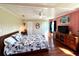 Bright bedroom featuring a comfortable bed and ample closet space at 743 Tangerine Woods Blvd, Englewood, FL 34223