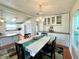 Dining area with table and chairs, situated between the kitchen and living room at 743 Tangerine Woods Blvd, Englewood, FL 34223