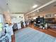 Open living space with hardwood floors, and comfortable seating at 743 Tangerine Woods Blvd, Englewood, FL 34223