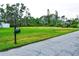 Vacant lot ready for your dream home, featuring a spacious grassy area at 5148 Guava Ter, Port Charlotte, FL 33981