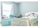 Well-lit bedroom with white bed frame and a toy hammock at 5148 Guava Ter, Port Charlotte, FL 33981