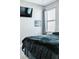 Bedroom with a bed, TV, and window at 5148 Guava Ter, Port Charlotte, FL 33981