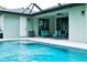 Refreshing pool with patio furniture and screened enclosure at 5148 Guava Ter, Port Charlotte, FL 33981