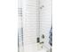 Bathroom with shower and white tile at 5148 Guava Ter, Port Charlotte, FL 33981