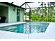 Inviting pool with screened enclosure and patio furniture at 5148 Guava Ter, Port Charlotte, FL 33981