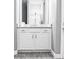 Bathroom with white vanity, granite countertop, and mirror at 5148 Guava Ter, Port Charlotte, FL 33981