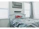 Bedroom featuring a bed, American flag art, and window blinds at 5148 Guava Ter, Port Charlotte, FL 33981