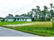 Single-Gathering home with a large backyard and lush green lawn at 5148 Guava Ter, Port Charlotte, FL 33981