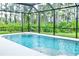 Enclosed pool area with lush greenery views at 5148 Guava Ter, Port Charlotte, FL 33981