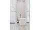 Bathroom with freestanding bathtub, subway tile, and wood-look tile flooring at 5148 Guava Ter, Port Charlotte, FL 33981