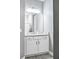 Bathroom with white vanity, granite countertop, and mirror at 5148 Guava Ter, Port Charlotte, FL 33981