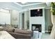 Cozy living room features a fireplace and large TV at 5148 Guava Ter, Port Charlotte, FL 33981