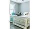 Charming bedroom with white bed frame and floral bedding at 5148 Guava Ter, Port Charlotte, FL 33981