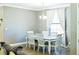 Bright dining room with a rustic farmhouse table and six chairs at 5148 Guava Ter, Port Charlotte, FL 33981