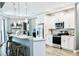 Spacious kitchen with white cabinets, granite countertops, and stainless steel appliances at 5148 Guava Ter, Port Charlotte, FL 33981
