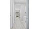 Bright hallway with tile floors, leading to laundry and dining areas at 5148 Guava Ter, Port Charlotte, FL 33981
