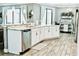 Modern kitchen with white cabinets, granite countertops, and stainless steel appliances at 5148 Guava Ter, Port Charlotte, FL 33981