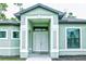 White double front doors with a decorative entryway at 5148 Guava Ter, Port Charlotte, FL 33981