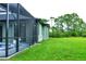 Side view of the house showing a screened enclosure and pool at 5148 Guava Ter, Port Charlotte, FL 33981