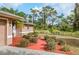 Brick walkway and manicured landscaping leading to the home's entrance at 11786 De Miranda Ave, North Port, FL 34287