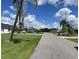 Residential street view showcasing a peaceful neighborhood setting at 181 N Waterway Nw Dr, Port Charlotte, FL 33952