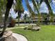 Seating area by canal with lush landscaping at 181 N Waterway Nw Dr, Port Charlotte, FL 33952
