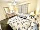 Guest bedroom with twin beds, dresser and window coverings at 181 N Waterway Nw Dr, Port Charlotte, FL 33952
