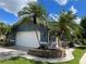 Single-story home with attached garage and attractive landscaping at 181 N Waterway Nw Dr, Port Charlotte, FL 33952