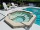 Relaxing hot tub adjacent to refreshing swimming pool at 181 N Waterway Nw Dr, Port Charlotte, FL 33952