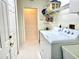 Laundry room with washer, dryer, and ample shelving for storage at 181 N Waterway Nw Dr, Port Charlotte, FL 33952