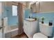 Bathroom features classic blue tile, tub-shower combo, and vanity with sink at 2513 Elkcam Blvd, Port Charlotte, FL 33952