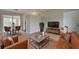Open-concept living room showcasing sleek furniture, hardwood floors, and stylish decor at 2513 Elkcam Blvd, Port Charlotte, FL 33952