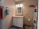 Clean bathroom with vanity, shelving, and toilet at 829 Pineland Ave, Venice, FL 34285