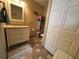 Clean bathroom with vanity, shelving and toilet at 829 Pineland Ave, Venice, FL 34285