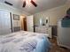 Bedroom with a dresser, mirror and double doors at 829 Pineland Ave, Venice, FL 34285