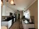 Bright kitchen with white cabinets, granite countertops, and stainless steel appliances at 829 Pineland Ave, Venice, FL 34285