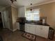 Updated kitchen with white cabinets, granite counters, and stainless steel appliances at 829 Pineland Ave, Venice, FL 34285