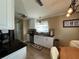 Modern kitchen with white cabinets and stainless steel appliances at 829 Pineland Ave, Venice, FL 34285