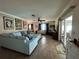 Spacious living area featuring a light blue sectional and tile floors at 829 Pineland Ave, Venice, FL 34285