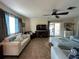 Comfortable living room with off-white and light blue sofas at 829 Pineland Ave, Venice, FL 34285