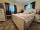 Bright bedroom with a white bed frame and relaxing decor at 829 Pineland Ave, Venice, FL 34285