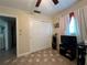 Home office with closet, TV, and flooring at 829 Pineland Ave, Venice, FL 34285