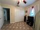 Home office with closet, TV, and flooring at 829 Pineland Ave, Venice, FL 34285
