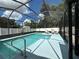 Inviting screened pool with lounge chairs at 829 Pineland Ave, Venice, FL 34285