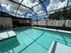 Refreshing screened pool ready for summer fun at 829 Pineland Ave, Venice, FL 34285