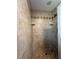Large walk-in shower with tile and built-in seat at 829 Pineland Ave, Venice, FL 34285