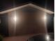 Back exterior of the house at night with lighting at 829 Pineland Ave, Venice, FL 34285