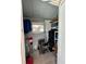 Storage area with shelving and a generator at 829 Pineland Ave, Venice, FL 34285