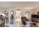 Spacious living room with recliner, TV, and view to kitchen at 1515 Forrest Nelson Blvd # H108, Port Charlotte, FL 33952