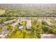 Aerial view of condo community with building, pool, and surrounding landscape at 1515 Forrest Nelson Blvd # H108, Port Charlotte, FL 33952